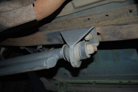 1996 Ford Bronco - Underside view of a vehicle's suspension system, showing a custom bracket and linkage.