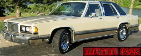 1988 Mercury Grand Marquis - Wide forum-signature banner showing a champagne/tan Mercury Grand Marquis four-door sedan in profile with a slight front bias, parked on gr…