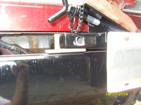 1989 Ford Bronco - Close-up of a vehicle's rear bumper and trailer hitch assembly, with visible date and website watermark.