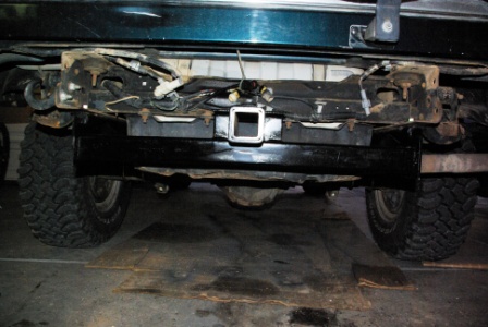 1995 Ford Bronco - Rear view of a 1995 Ford Bronco showing the hitch assembly and tires.