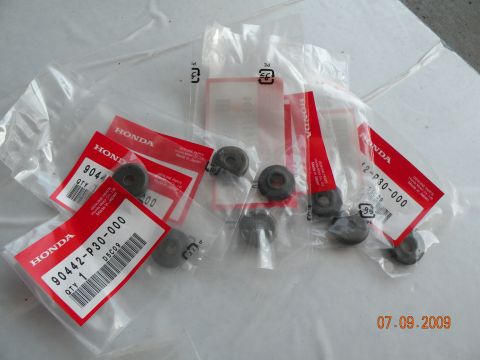 1994 Acura Integra - Several Honda genuine parts are packaged individually with red labels indicating part numbers and quantity.
