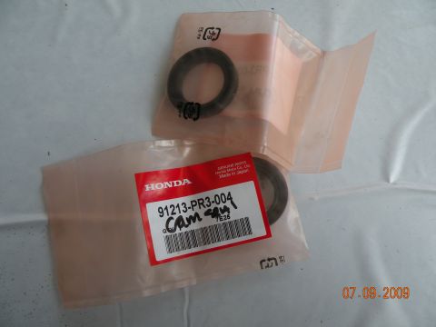 1994 Acura Integra - Genuine Honda parts, including a cam seal, are shown in their original packaging.