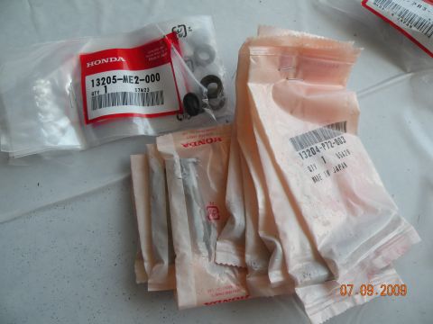 1994 Acura Integra - Several packages of Honda automotive parts are shown, including items with part numbers 13205-ME2-000 and 13204-P72-003.