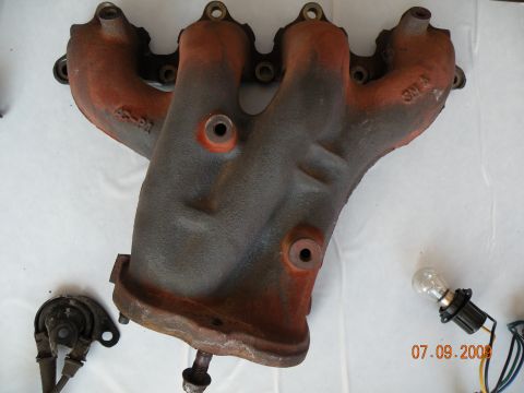 1994 Acura Integra - Exhaust manifold part shown with a light bulb and wiring. Date stamp visible on image.