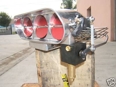 1972 Ford Ranchero - This chrome intake manifold with three red air filters is a vehicle part, not a 1972 Ford Ranchero.