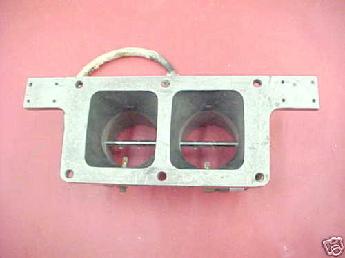 Dual throttle body with two square openings and red butterfly valves