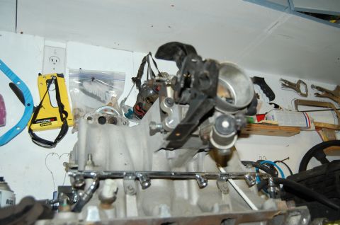 1994 Ford Bronco - Close-up view of an engine intake manifold assembly, including the throttle body and fuel rails.