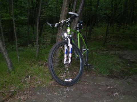 1981 Garelli Rally Sport - Mountain bike parked in the woods, showing its front wheel and handlebars.