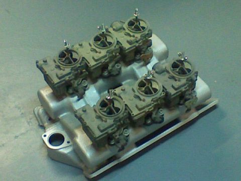 1974 Ford Ranchero - This image shows a pair of dual quad carburetors attached to an intake manifold, likely for an engine build.