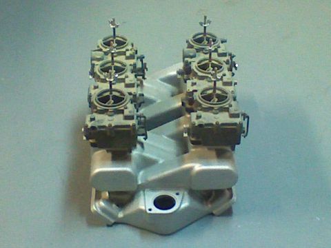 1974 Ford Ranchero - A dual quad intake manifold with carburetors is shown from a top-down perspective.