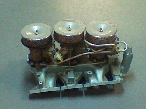 1974 Ford Ranchero - A triple carburetor setup with chrome air cleaner lids is shown.