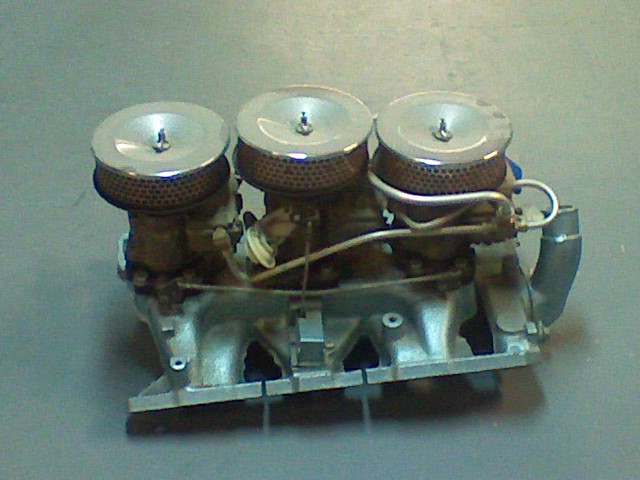 Triple carburetor setup with chrome air cleaner lids