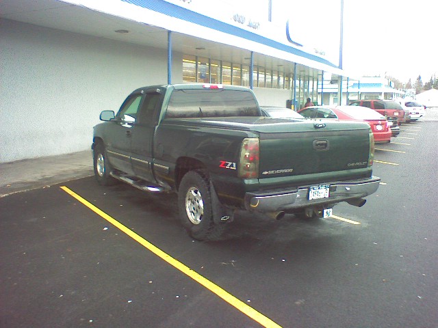 Green Chevrolet pickup truck, rear view, 2003 model