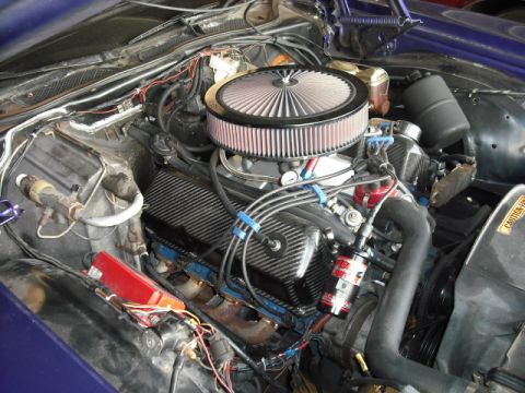 1974 Ford Ranchero - Close-up view of a modified engine bay, showing various aftermarket performance parts.