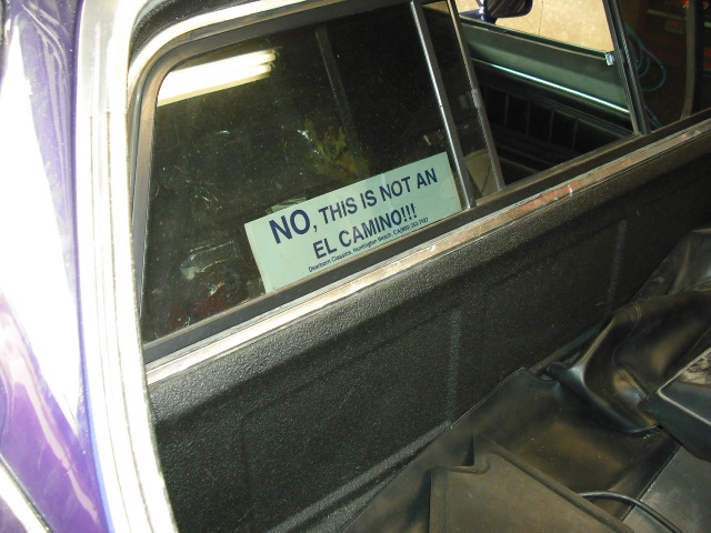 Interior view of a vehicle with a sticker stating 'NO, THIS IS NOT AN EL CAMINO!!!'