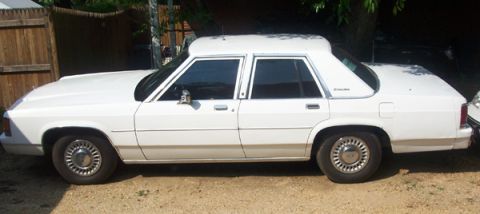 1991 Ford Crown Victoria LTD - This 1991 Ford Crown Victoria LTD is seen from the side, showing its distinctive raised roof modification.
