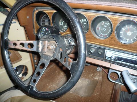 1975 Ford Ranchero - Interior view of a 1975 Ford Ranchero, an aftermarket steering wheel and dashboard gauges.