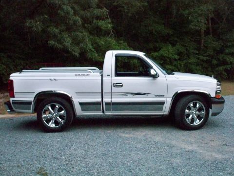 2002 Chevrolet Silverado 1500 - A white 2002 Chevrolet Silverado 1500 pickup truck is shown from the side.