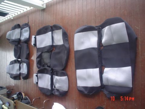 2005 Ford Excursion - Car seat covers are displayed on a wall, with a timestamp and website visible in the lower right corner.