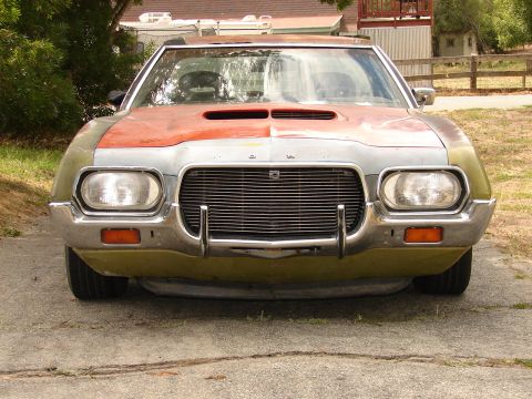 1973 Ford Ranchero - This vehicle has a unique front end with a prominent grille and a hood scoop.