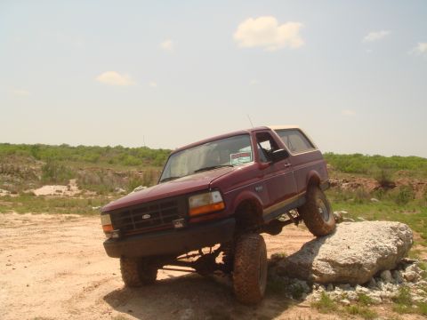 1992 Ford Bronco - This 1992 Ford Bronco is navigating a rocky obstacle during an off-road excursion.