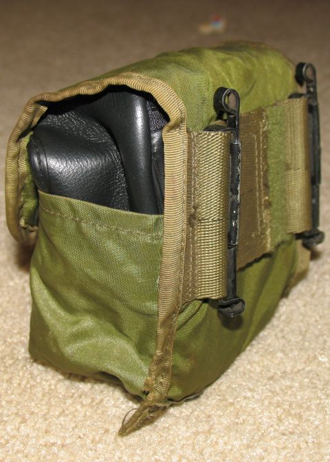 1984 Ford Bronco - This is a military-style pouch with a black leather item inside.