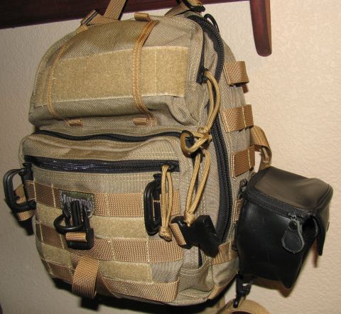 1984 Ford Bronco - Tactical backpack with multiple compartments and attachment points, including a side pouch.