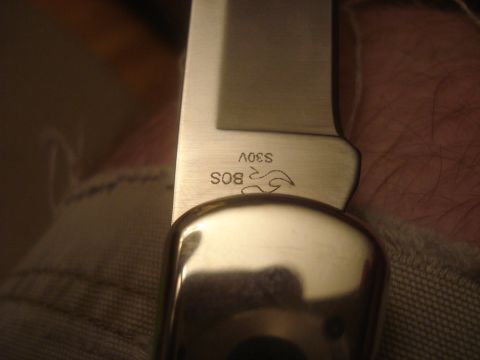 2000 Ford Crown Victoria - Knife blade marked with 'BOS S30V' and a stylized flame logo is visible.