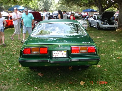 1978 Ford Mustang II - Rear view of a green 1978 Ford Mustang II at a car show.