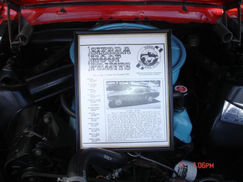 1978 Ford Mustang II - A framed document from the Sierra Mustang Club is displayed in the engine bay of a vehicle.