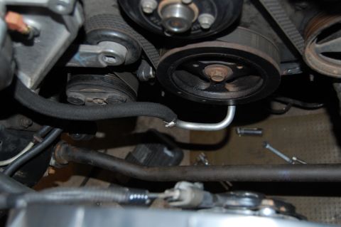 1985 Mercury Grand Marquis - Close-up view of engine components including pulleys and belts, with a Supermotors.net watermark.