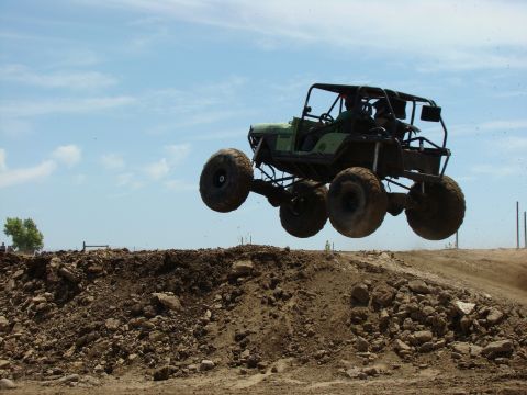 1989 Ford Bronco - Custom off-road buggy airborne during a jump event.