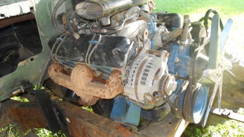 1980 Dodge Magnum - Close-up view of a V8 engine, likely from a truck or SUV, with visible rust on the exhaust.