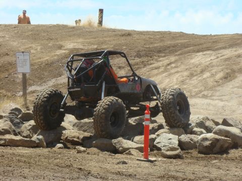 1989 Ford Bronco - A custom-built off-road buggy tackles a rocky obstacle course.