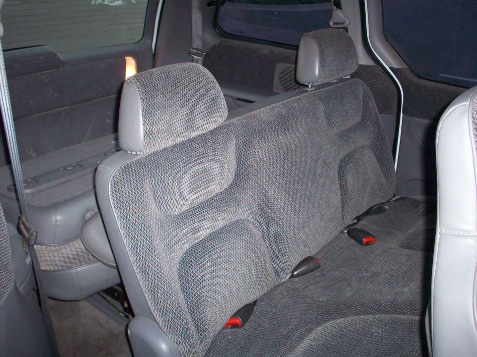 Gray fabric minivan rear seats and seatbelts