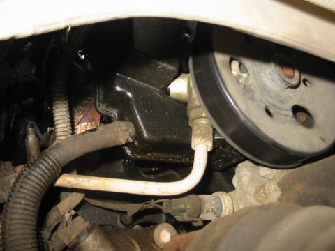 1997 Pontiac Grand Prix - Low pressure line with clamp on the bottom of the power steering pump.