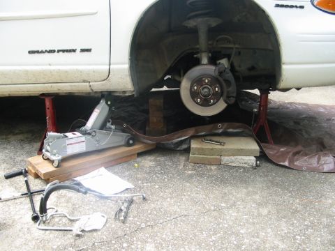 1997 Pontiac Grand Prix - Car jacked up with passenger tire removed.