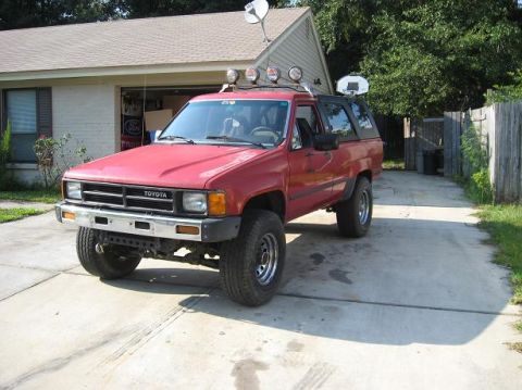 1987 Toyota 4Runner - Red 1987 Toyota 4Runner parked in driveway with a satellite dish and roof lights.