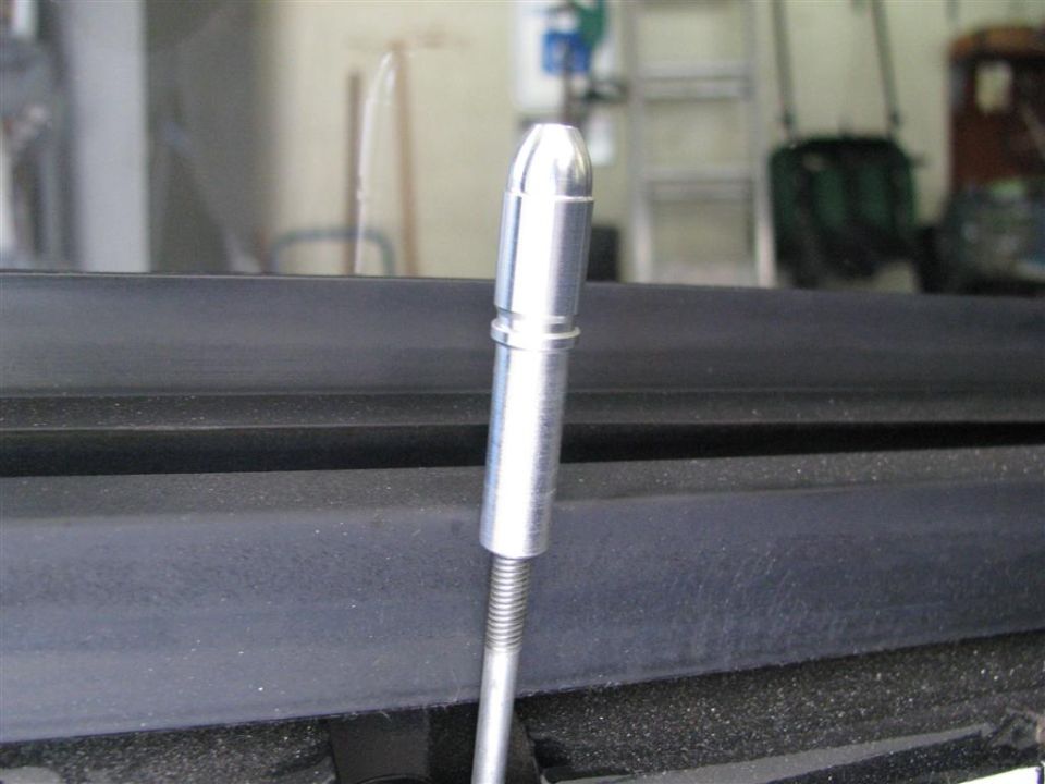 Close-up of an antenna base with threaded shaft