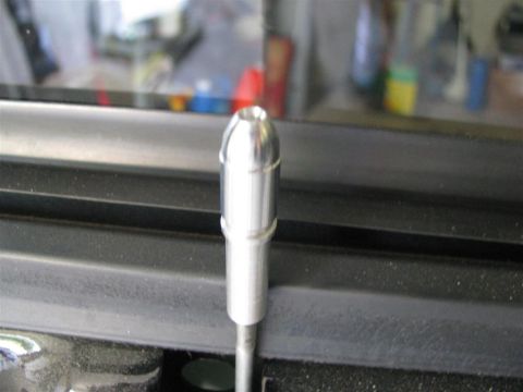 2003 Mercury Marauder - A chrome door pin is shown in close-up, with a Supermotors watermark at the bottom right.