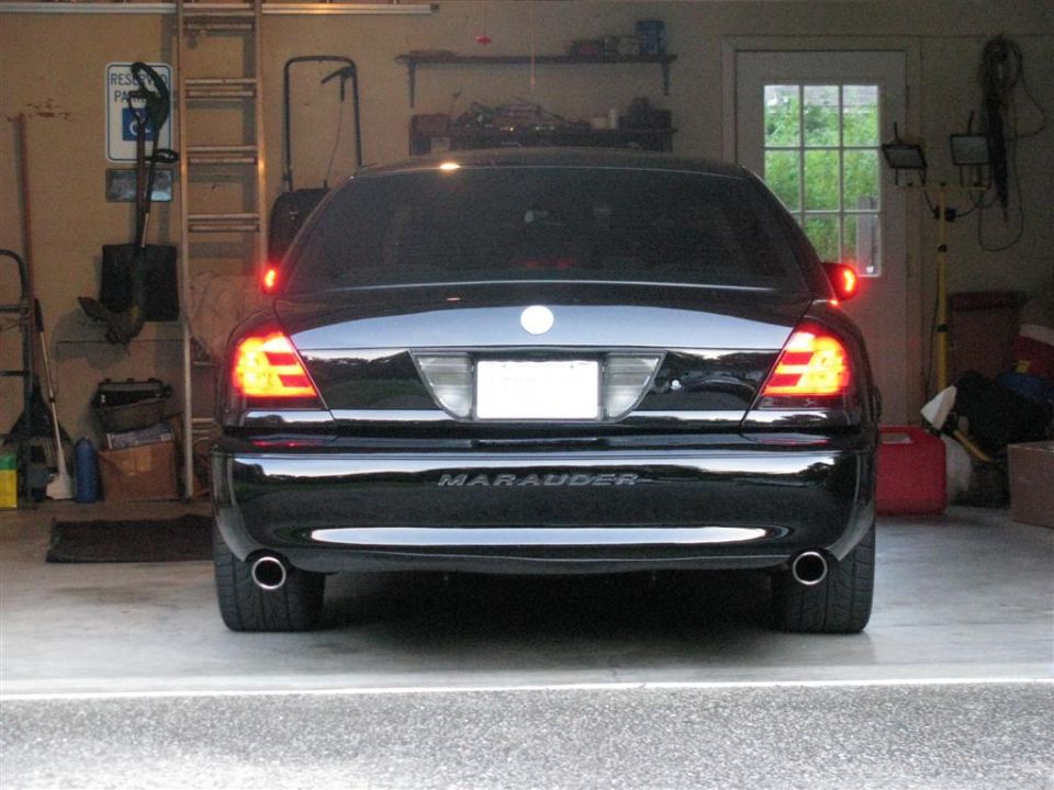 Black 2003 Mercury Marauder rear view in garage, showing taillights and "MARAUDER" badging