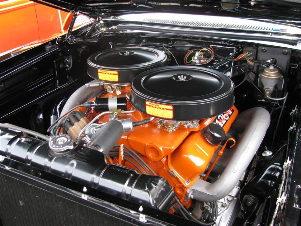 Orange V8 engine with dual black air cleaners and "426" decal
