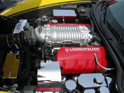 2003 Mercury Marauder - Close-up of a modified engine bay a Lingenfelter supercharger and custom red valve covers.
