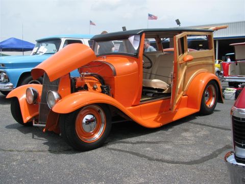 2003 Mercury Marauder - Custom hot rod woody wagon displayed at a car show with other vehicles present.