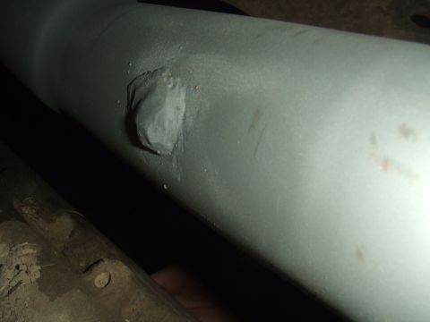 1996 Ford Bronco - Close-up view of a patched exhaust pipe, likely from the undercarriage of a vehicle.