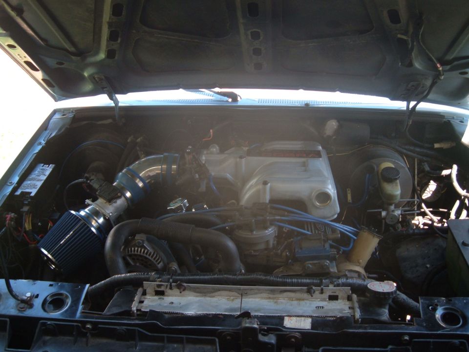 Engine bay of a 1990 Ford Ranger with aftermarket intake and V8 engine swap