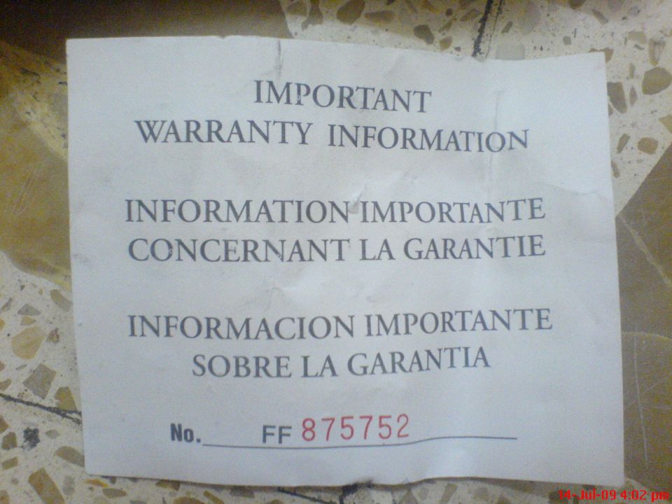 Paper with warranty info in English, French, and Spanish. Has a number FF 875752