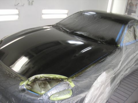1987 Suzuki Samurai - A car is prepared for painting inside a spray booth.