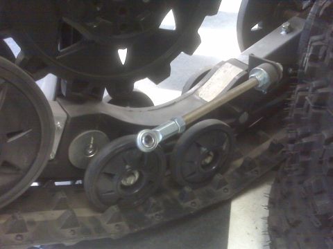 1987 Suzuki Samurai - Close-up of a vehicle track system, showing its mechanical components and tread pattern.