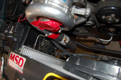 1985 Mercury Grand Marquis - Close-up of an engine bay, a turbocharger and an MSD sticker.